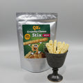 QB's Crunchy Cheese Stix packaging with a handful of Stix In a cup with a neutral background