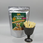 QB's Crunchy Cheese Stix packaging with a handful of Stix In a cup with a neutral background